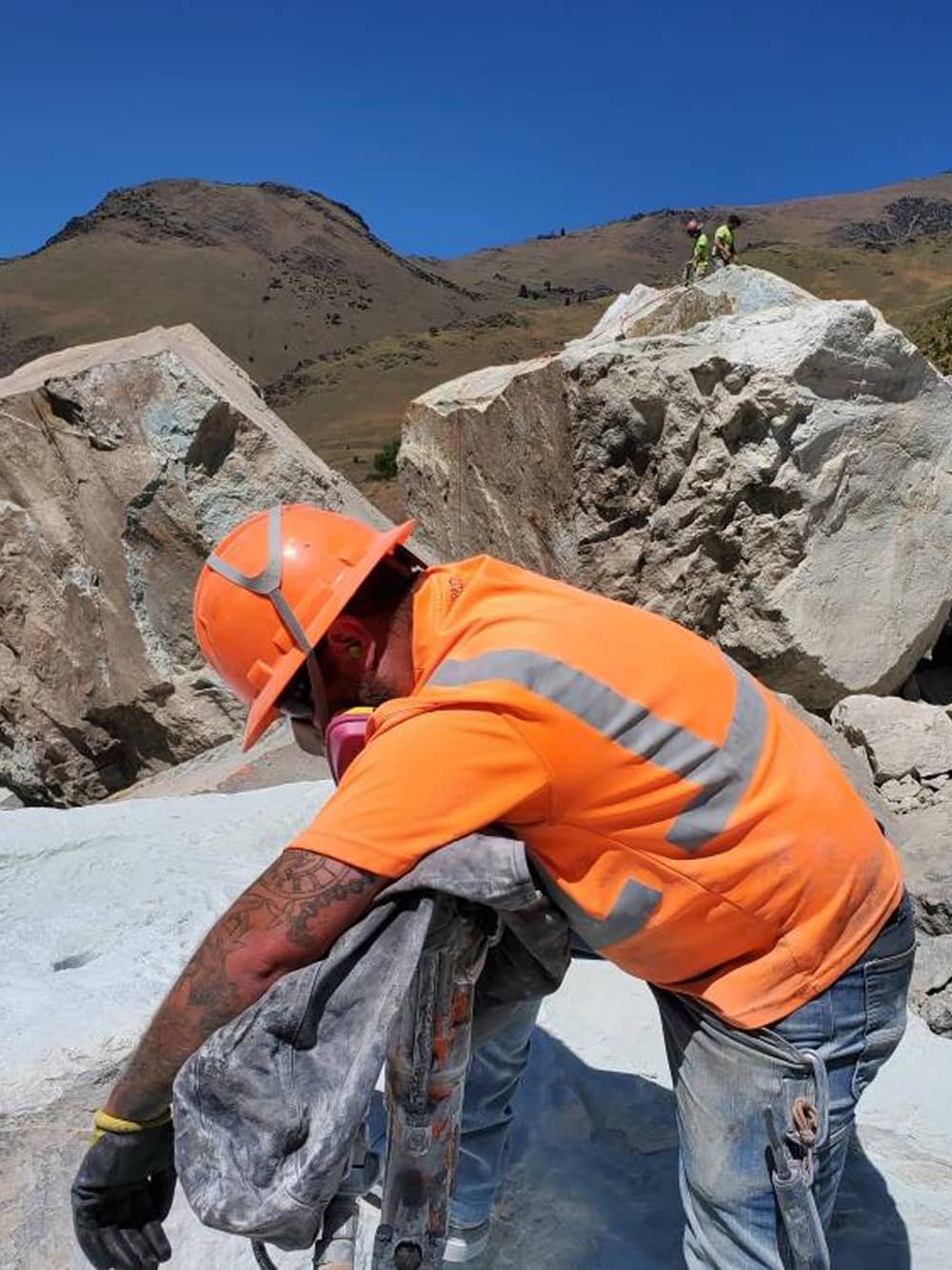 A photo of workers on a remote access soil drilling project